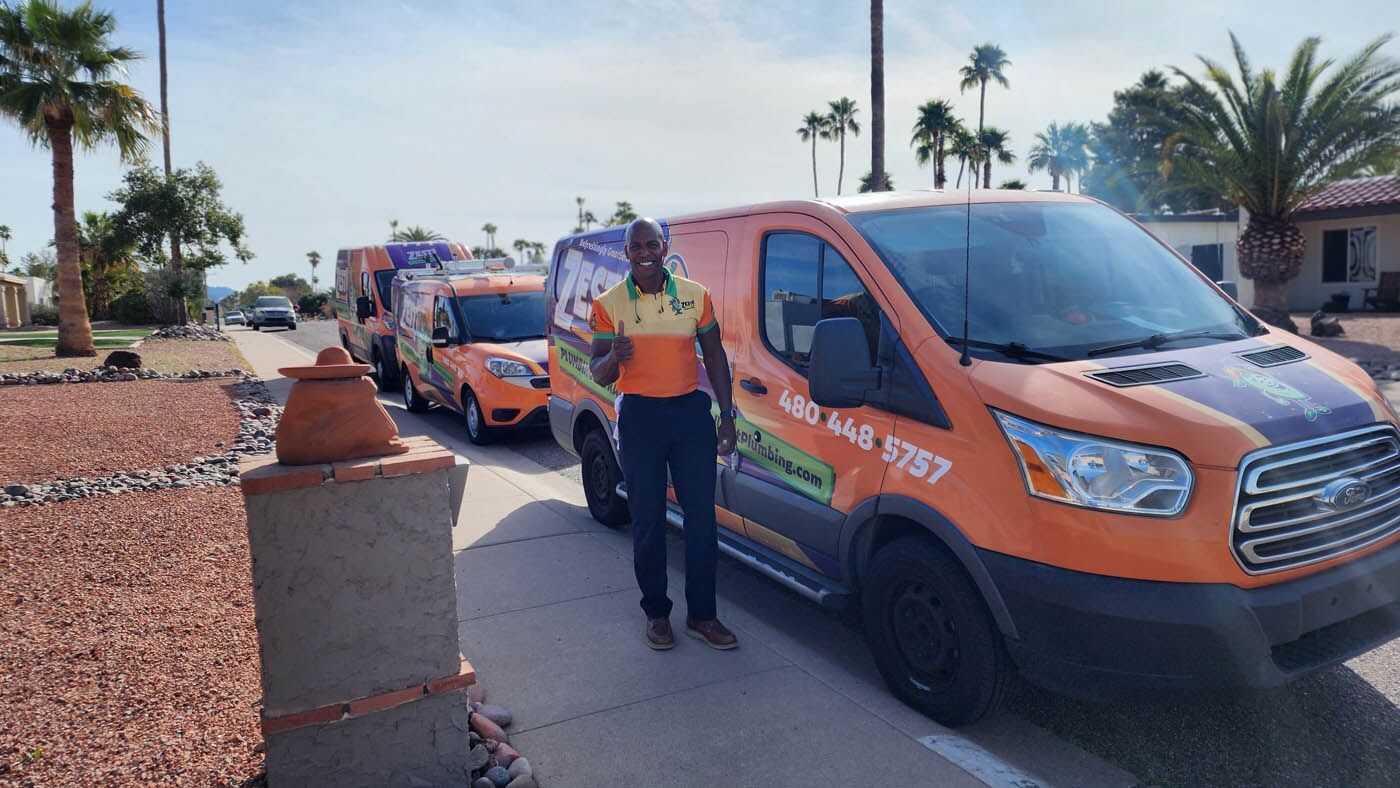 A Zest Plumbing & Drain technician standing in front of a van in Scottsdale, AZ.